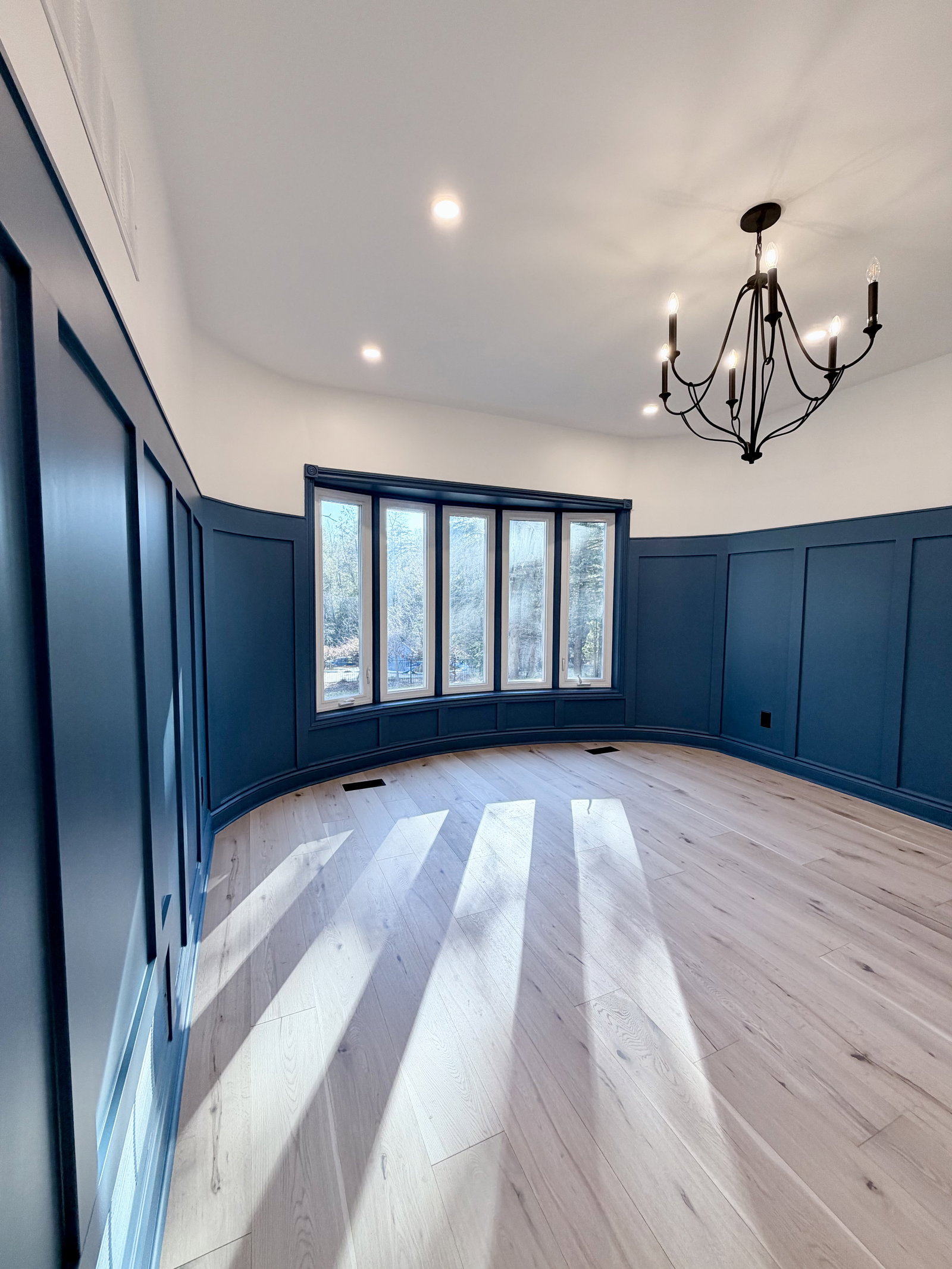Blue room with light floors.