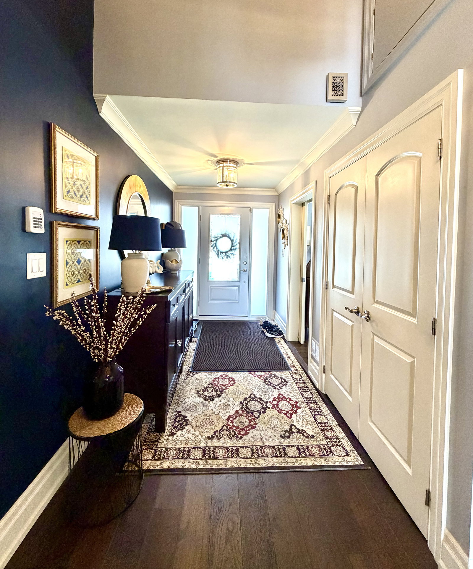 Modern home entryway with rugs.