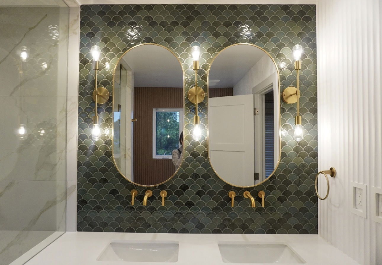 Elegant bathroom with green scalloped tile