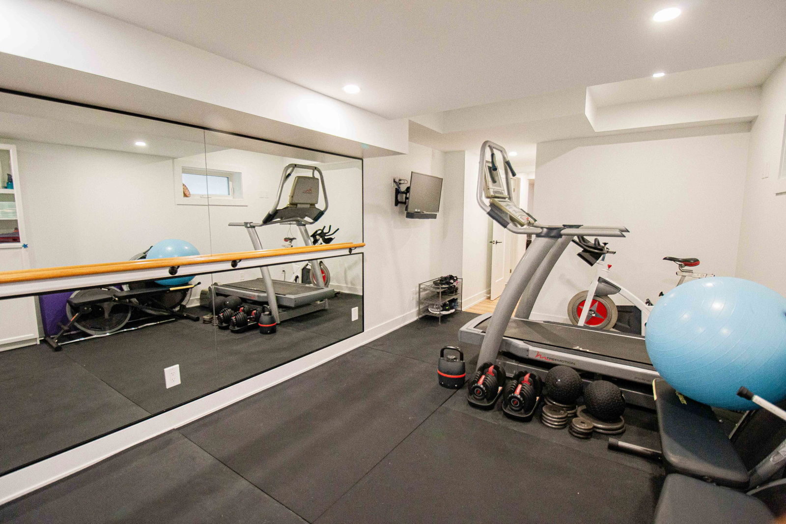 Home gym with mirrored wall