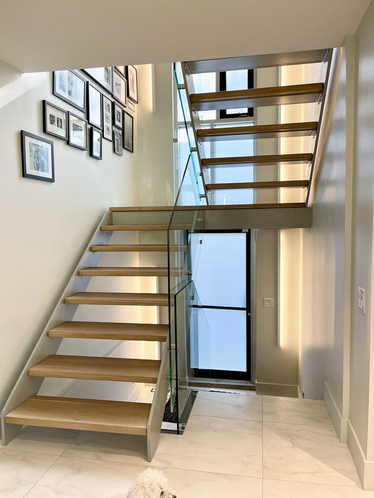 Modern staircase with gallery wall