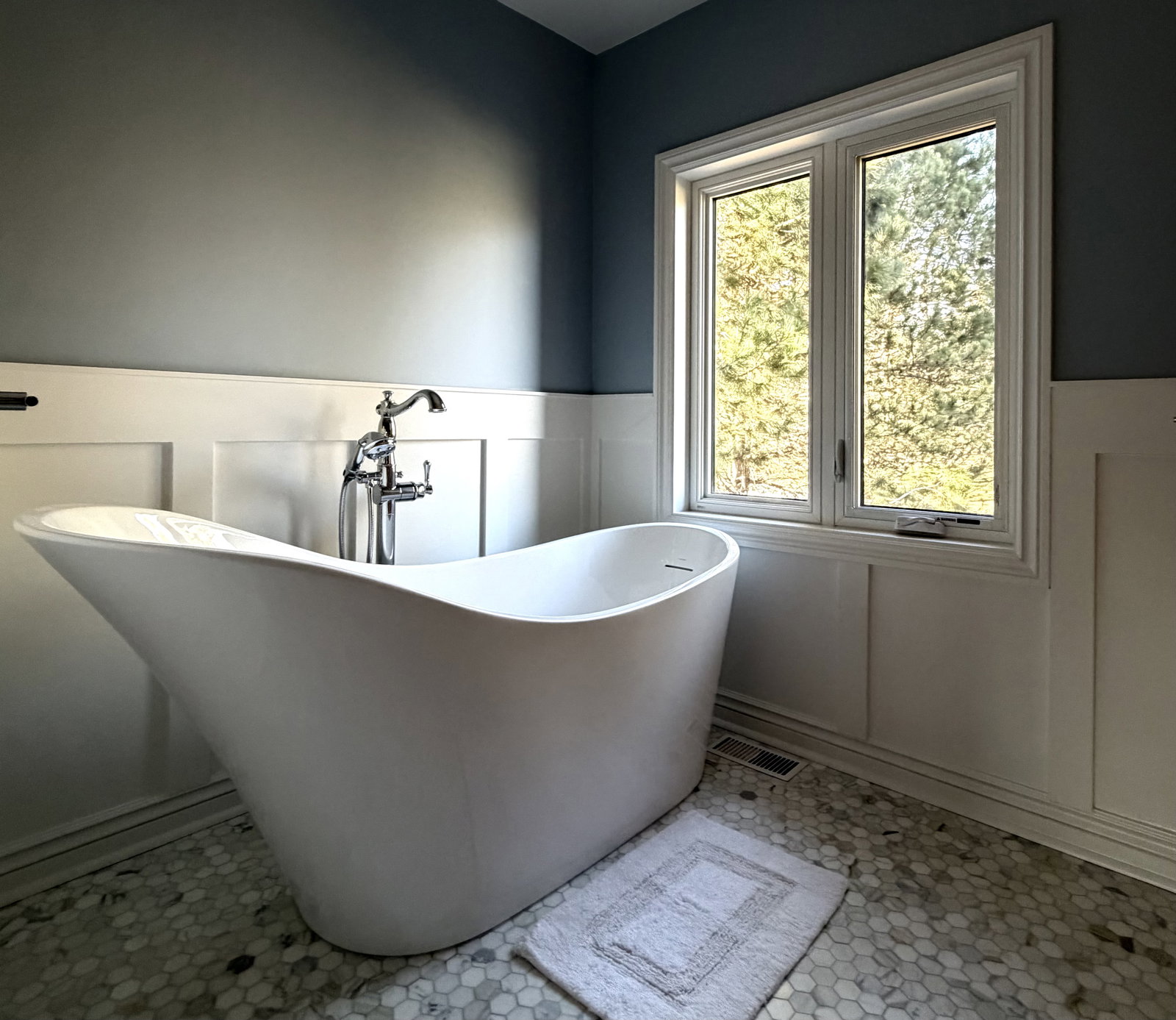 White bathtub in a bathroom.