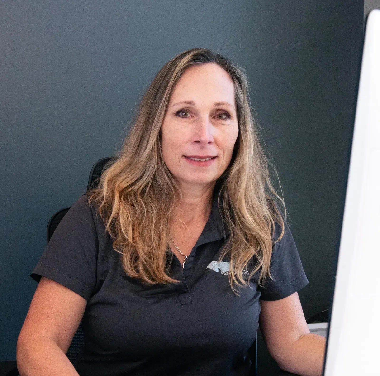 A headshot of Manager of Design and Sales, the Suzanne Morgan of Built by Pros Inc.